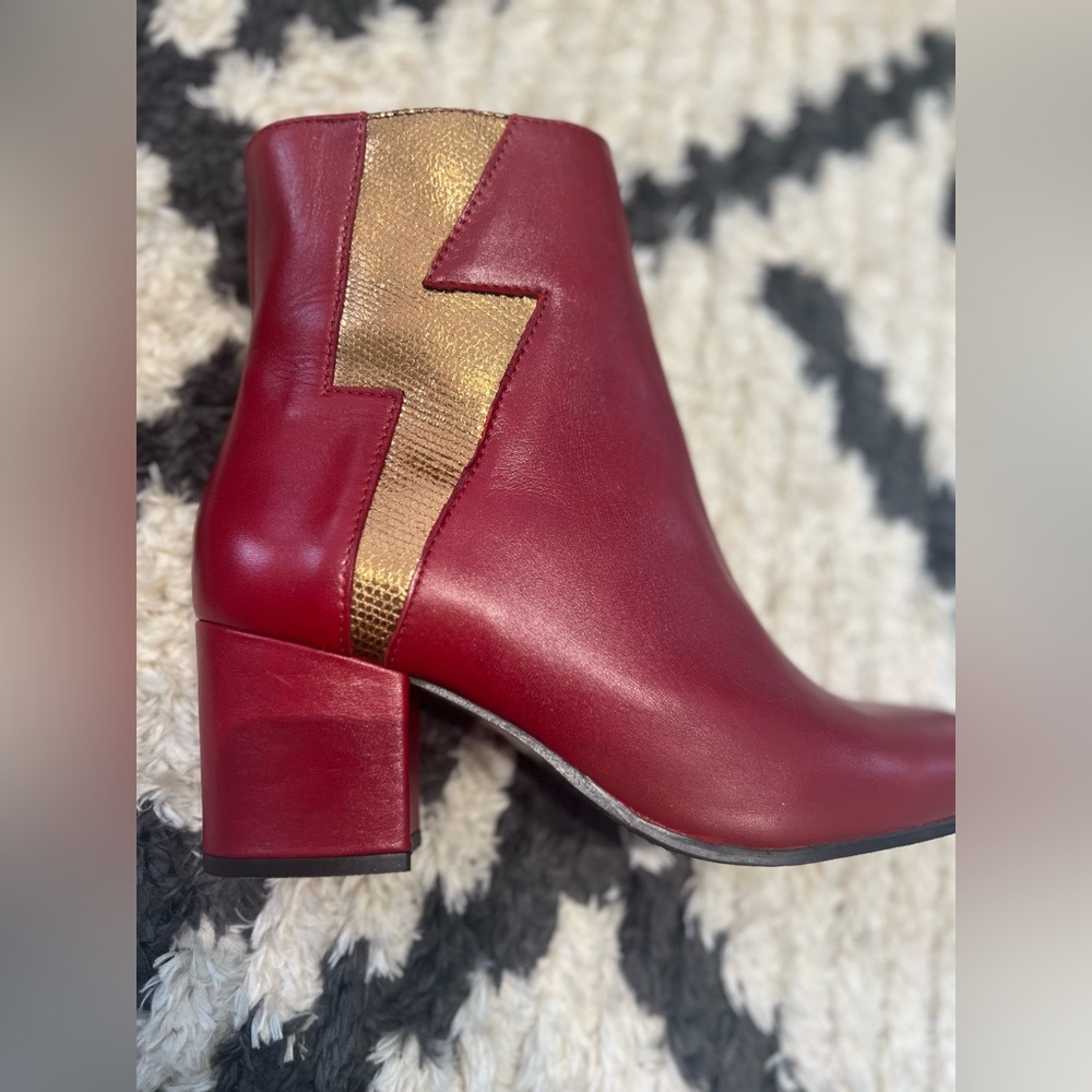 Red boots with gold lightning bolt